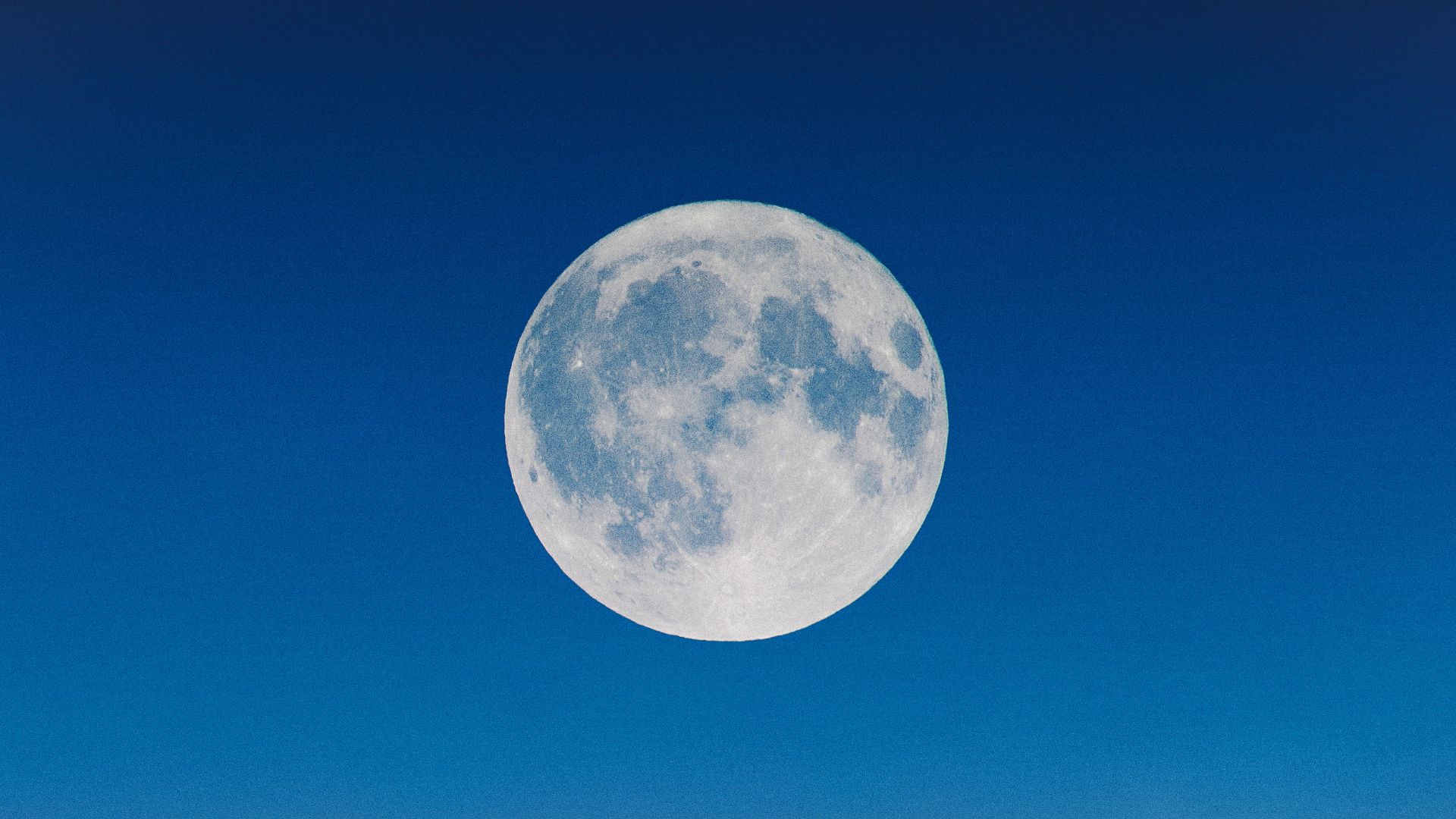 The moon against blue sky