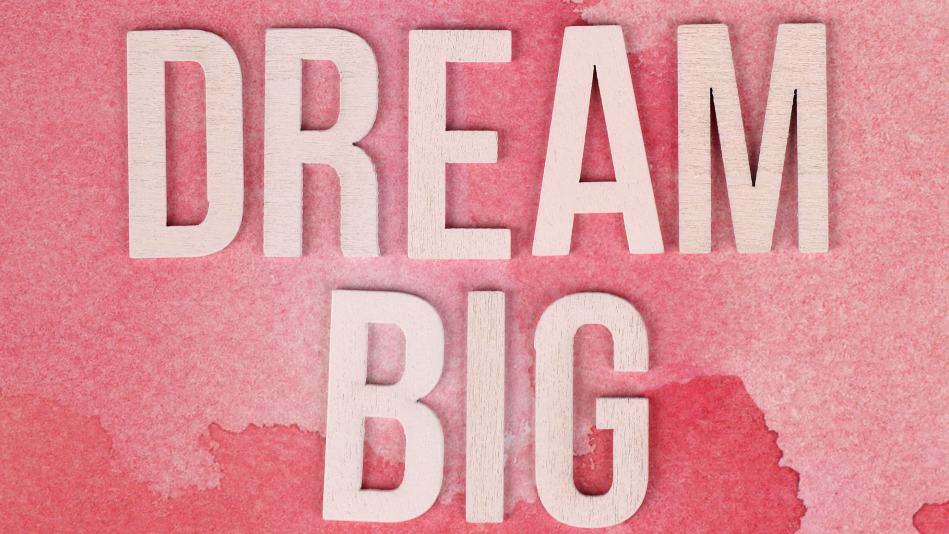 Dream Big words on a pink background