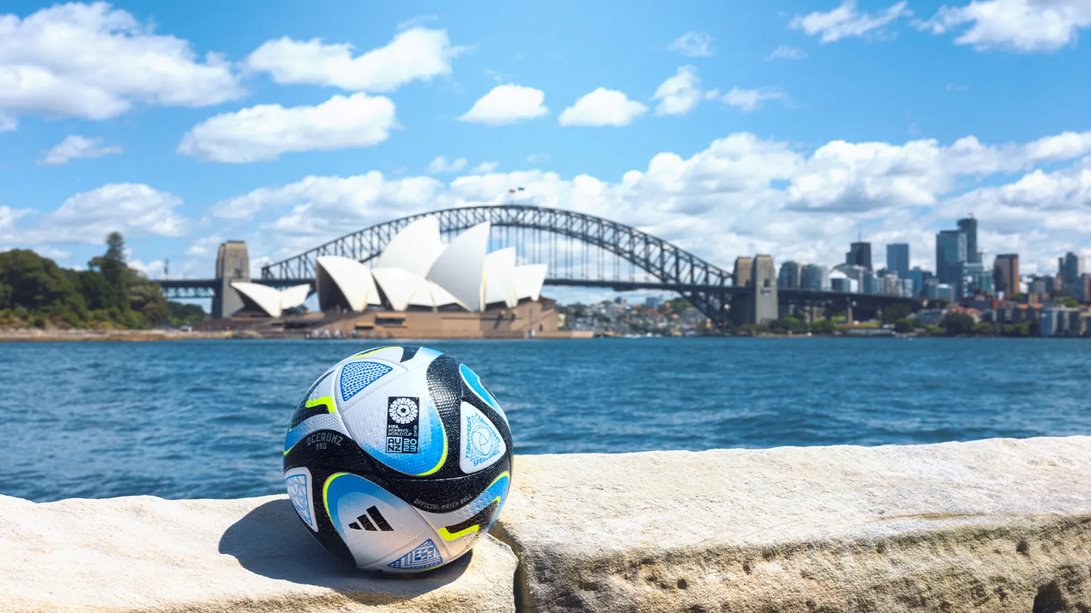 Football with Sydney opera house in distance